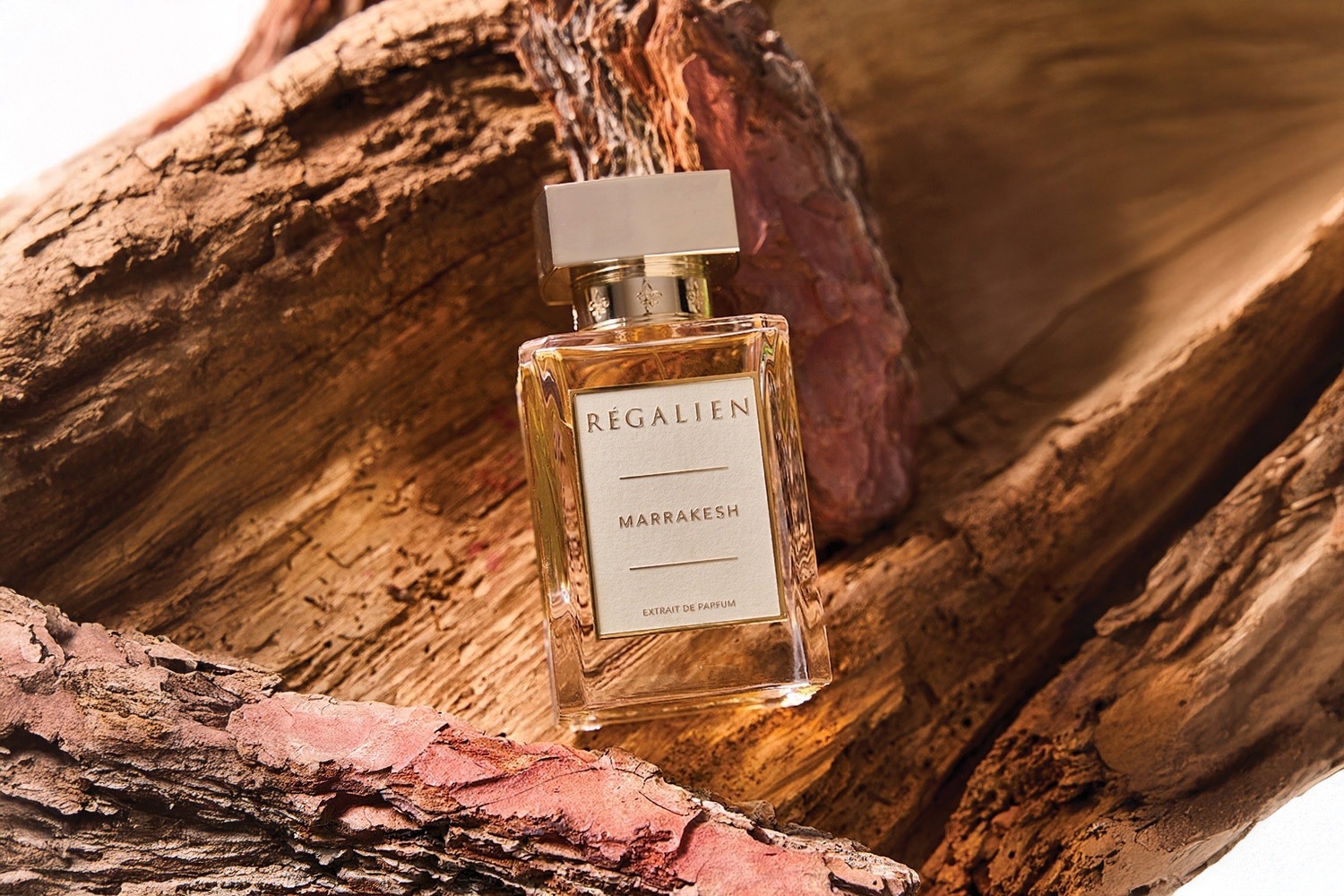 Régalién Marrakesh fragrance bottle on aged wood